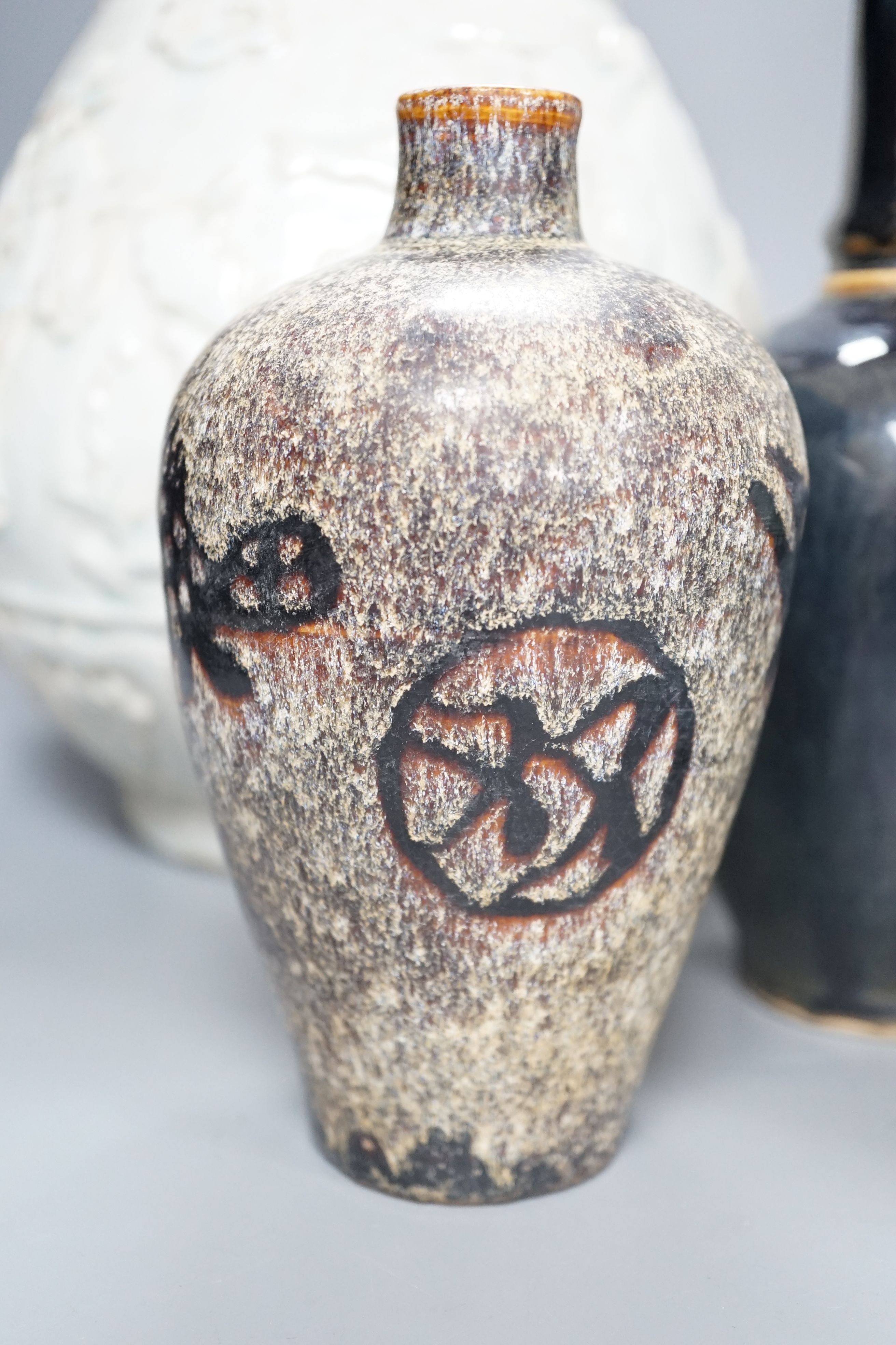 A Qingbai type bottle vase, a jar and cover, an apple green crackle glazed vase, a paper cut vase and a Song Dynasty style phoenix head bottle, tallest 38 cms high. (5)